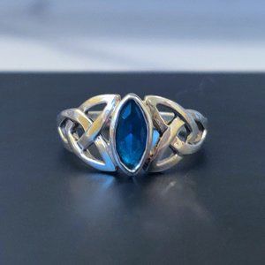 Celtic silver ring with blue gem